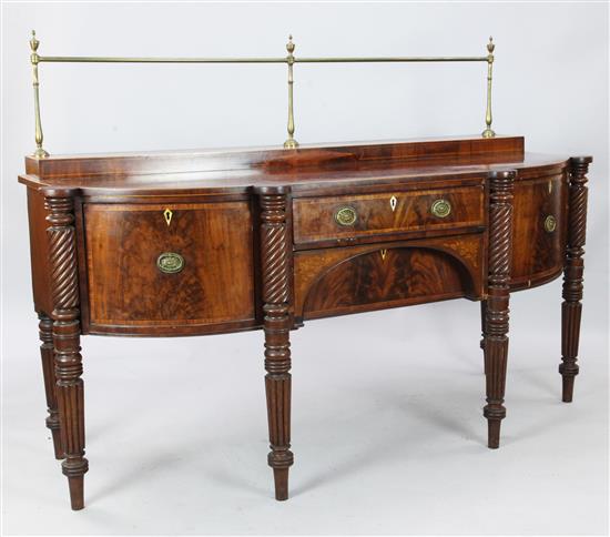 A George III cross banded and boxwood inlaid mahogany bowfront sideboard, W. 6ft 4in. D. 2ft 6in. H. 4ft 5in.